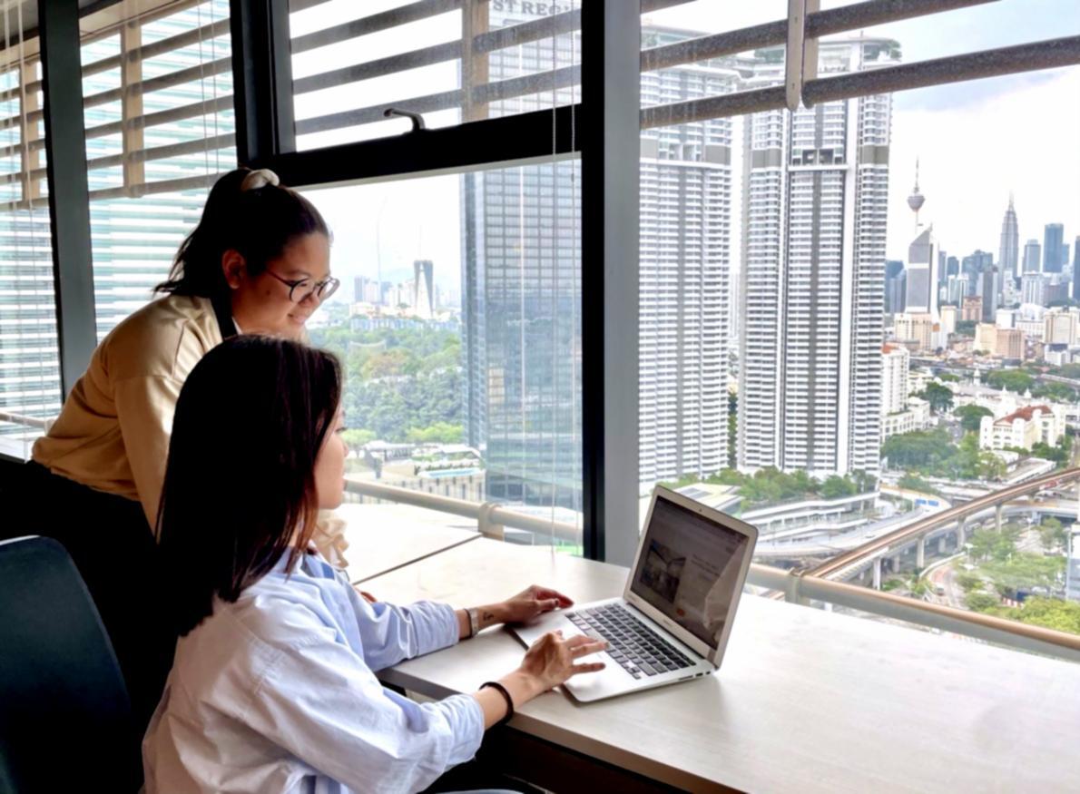 Business professionals reviewing adaptation strategies in a collaborative workspace